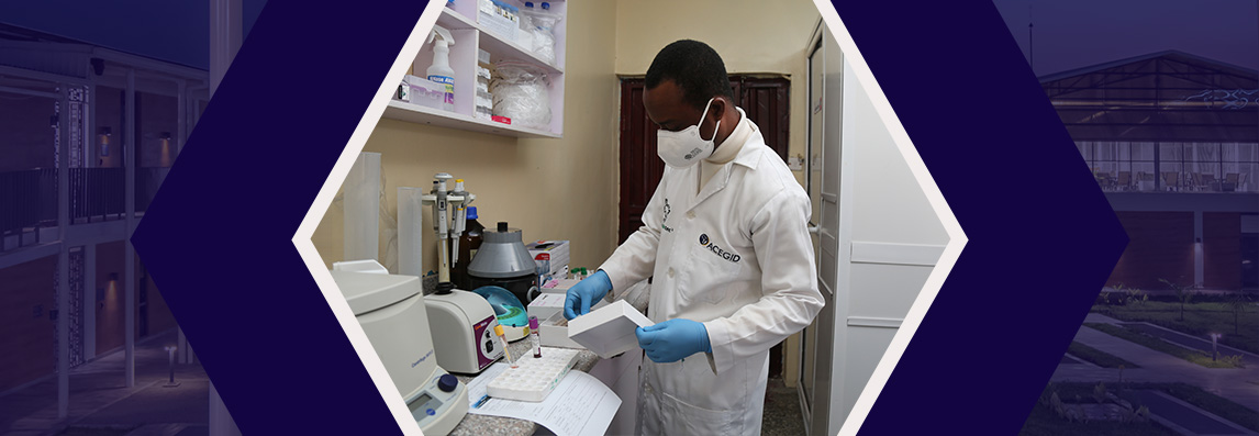 A scientist in white lab coat and blue gloves works  in a laboratory, handling scientific equipment.